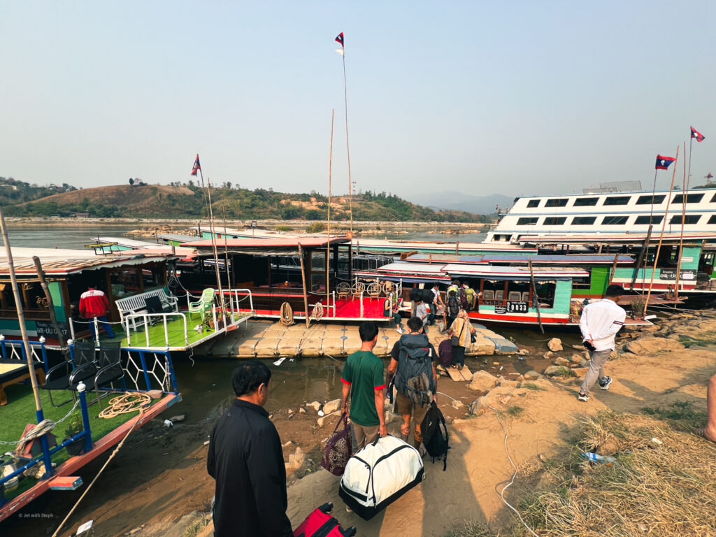 Passengers boarding the slow boat at Huay Xai pier, Laos 