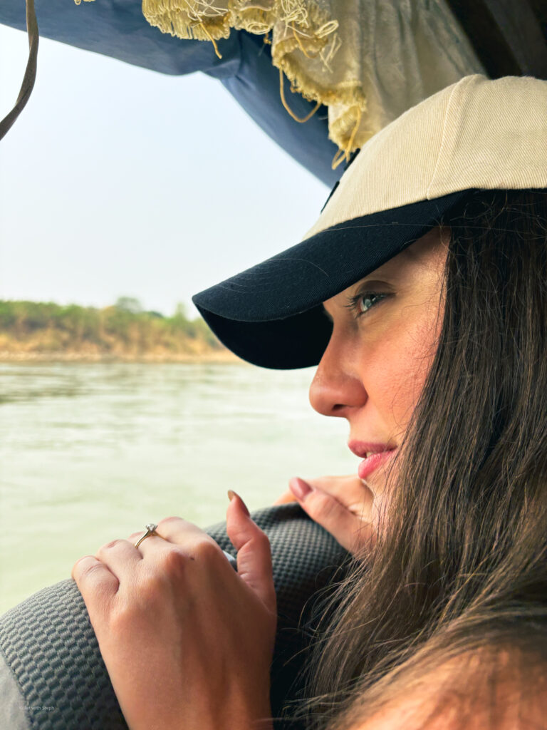 Steph looking out over the Mekong River from inside the slow boat