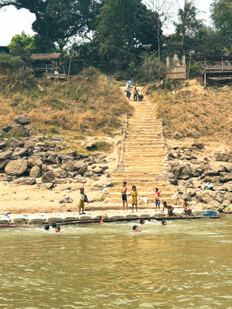 Local people on the banks of the Mekong river in Laos