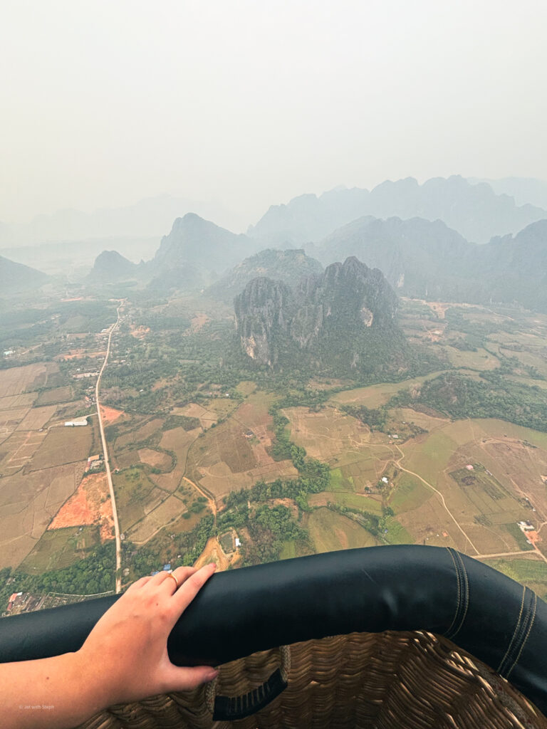 View over the side of a hot air balloon in Vang Vieng in Laos 