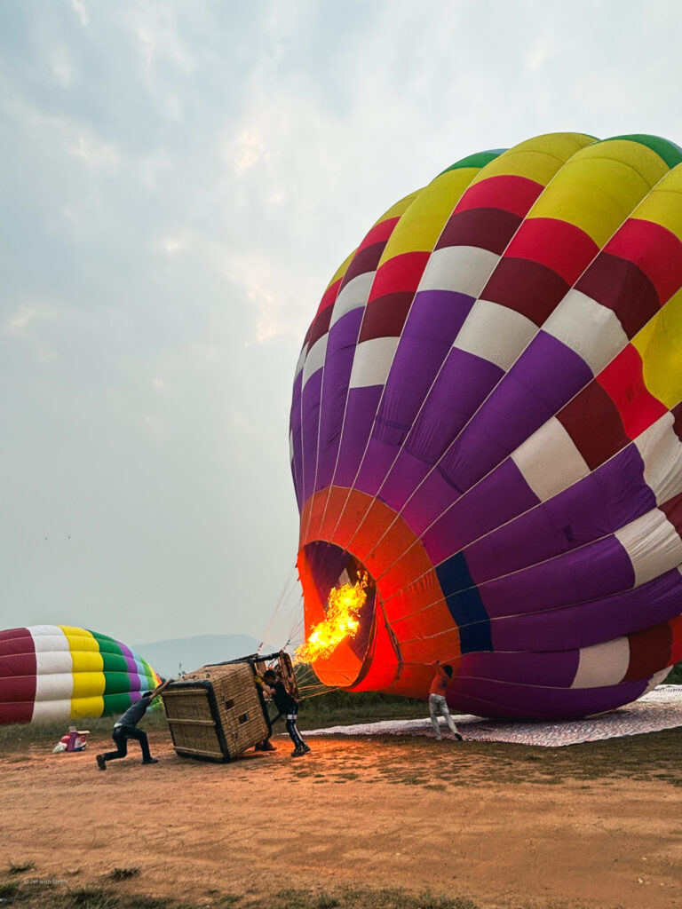 Inflating a hot air balloon in Vang Vieng, Laos