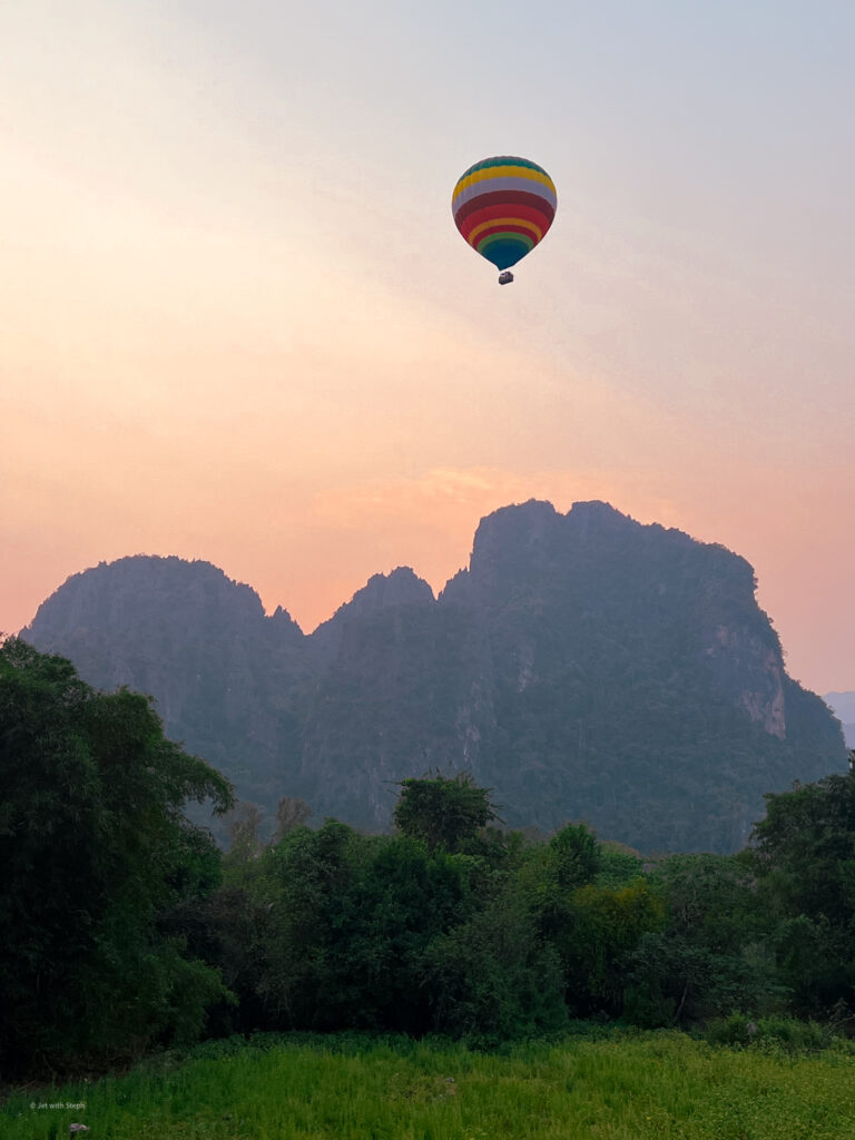 Hot air balloon flying over Vang Vieng, Laos 