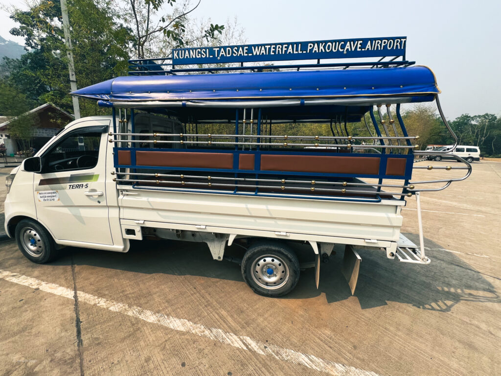 Songthaew truck at Kuang Si Waterfall car park